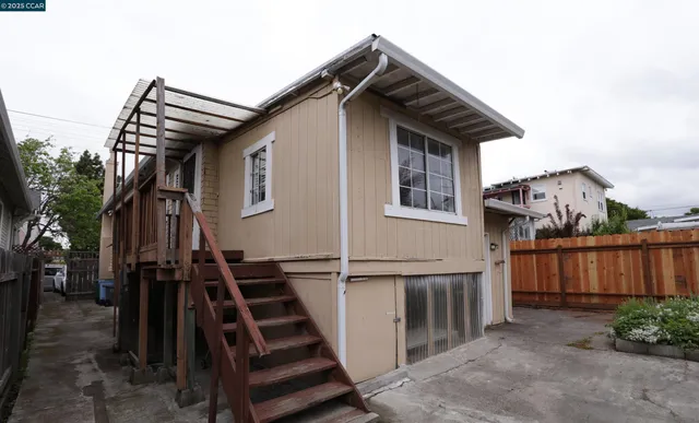 a view of an empty room with windows