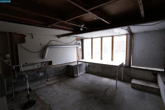 a view of a room with wooden walls