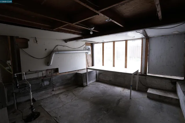 a view of a room with wooden walls