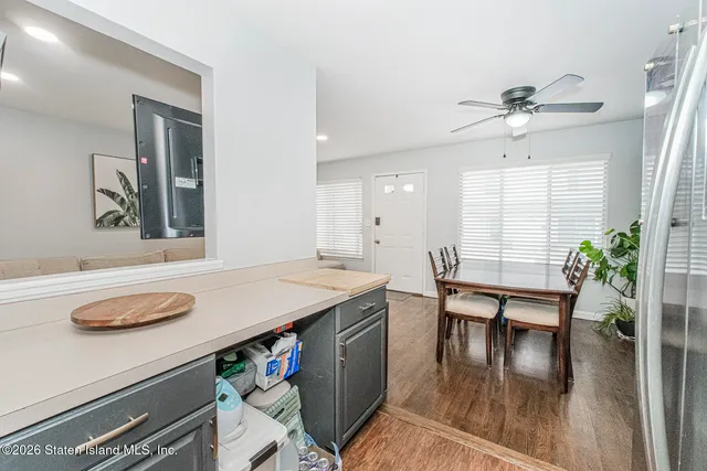 a hallway with a table and chairs