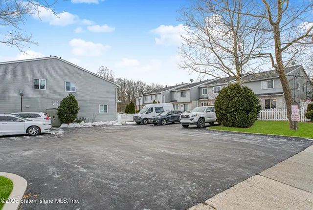 a view of a car parked in front of a house