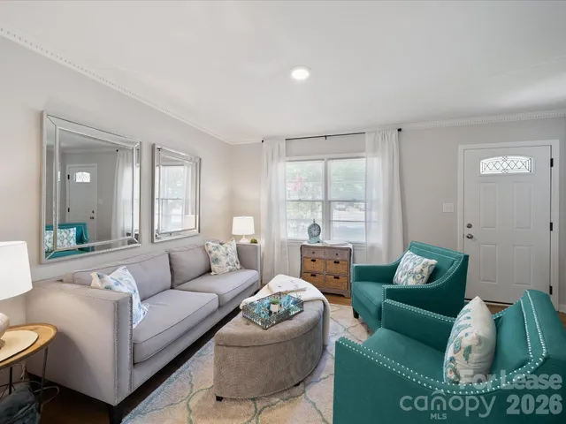 a living room with furniture and a window