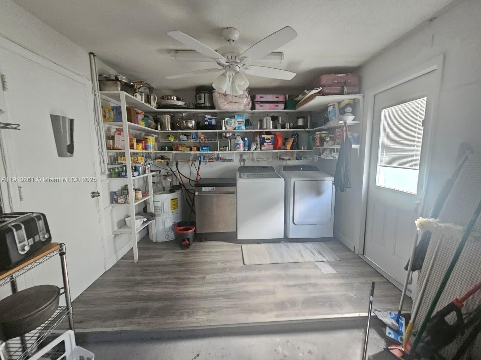 5010 Northwest 51st Court Tamarac, FL 33319 - Photo 15 of 16 a kitchen with stainless steel appliances granite countertop a refrigerator and a stove top oven
