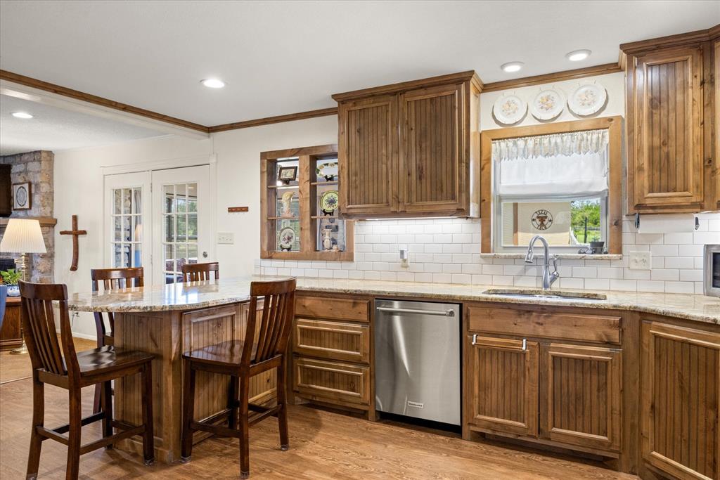 17305 Highway 281 Hico, TX 76457 - Photo 8 of 28 a kitchen with a sink and cabinets