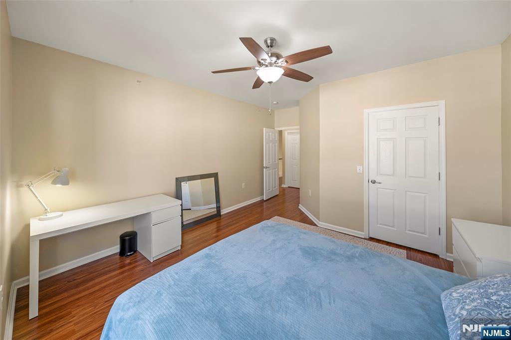 3 Holly Lane Garfield, NJ 07026 - Photo 20 of 34 a bedroom with a bed and a chandelier