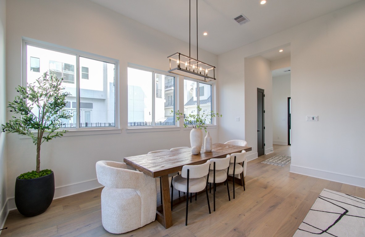 1645 Bingle Road Houston, TX 77055 - Photo 11 of 50 a view of a dining room with furniture window and wooden floor