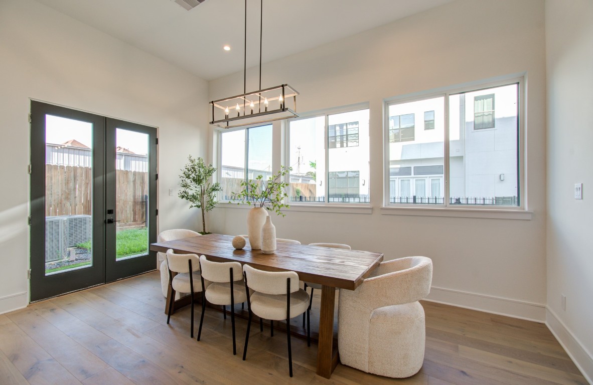 1645 Bingle Road Houston, TX 77055 - Photo 12 of 50 a view of a dining room with furniture window and wooden floor