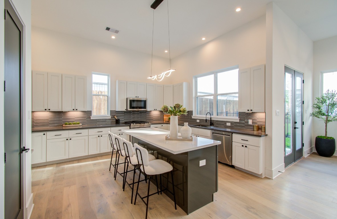 1645 Bingle Road Houston, TX 77055 - Photo 19 of 50 a kitchen with a sink a counter top space and stainless steel appliances