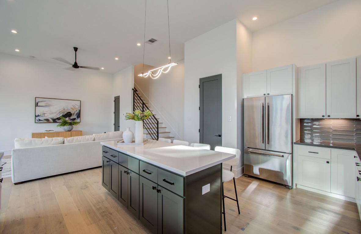 1645 Bingle Road Houston, TX 77055 - Photo 21 of 50 a kitchen with a sink refrigerator and microwave