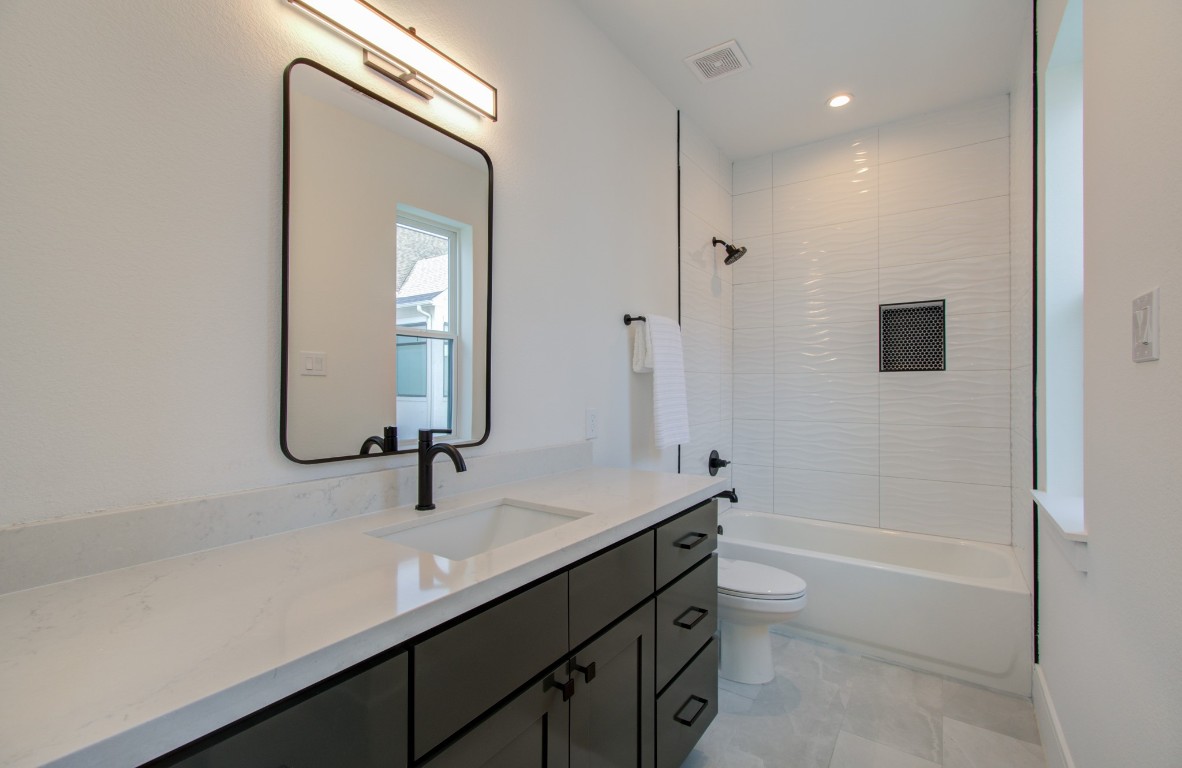 1645 Bingle Road Houston, TX 77055 - Photo 24 of 50 a bathroom with a sink a toilet and shower
