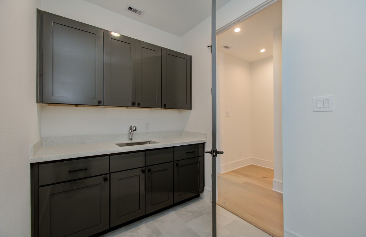 1645 Bingle Road Houston, TX 77055 - Photo 25 of 50 a bathroom with a sink a toilet and mirror