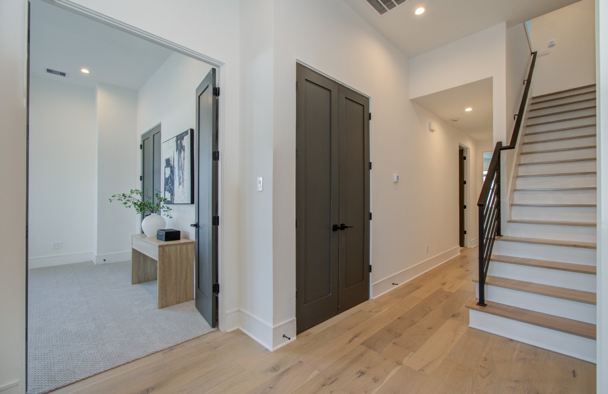 1645 Bingle Road Houston, TX 77055 - Photo 27 of 50 a view of a hallway with wooden floor and stairs