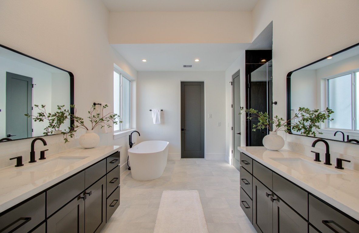 1645 Bingle Road Houston, TX 77055 - Photo 34 of 50 a spacious bathroom with a double vanity sink and a mirror