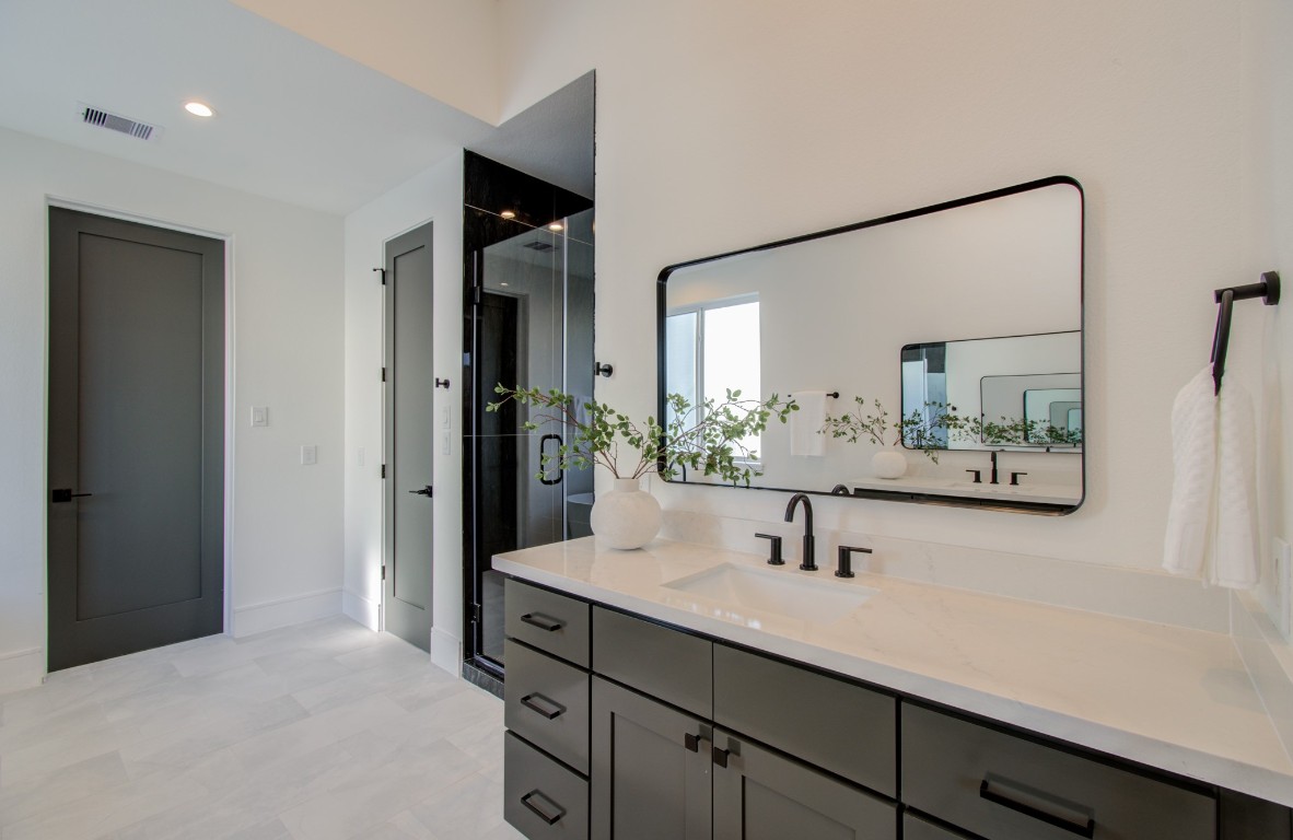 1645 Bingle Road Houston, TX 77055 - Photo 36 of 50 a bathroom with a sink and a mirror