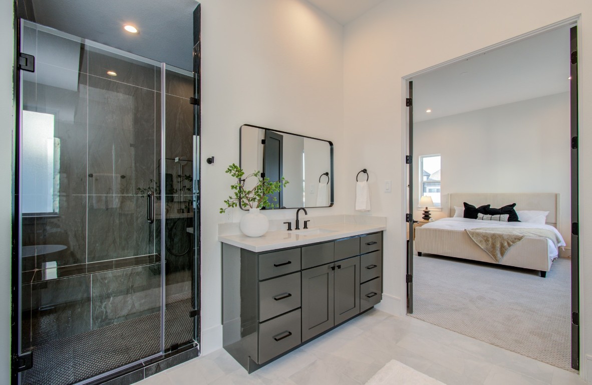 1645 Bingle Road Houston, TX 77055 - Photo 37 of 50 a spacious bathroom with a double vanity sink shower and mirror