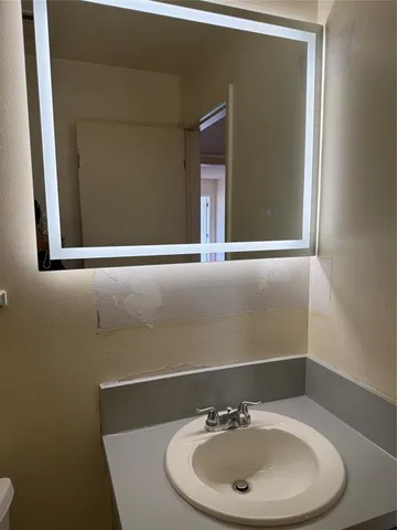 a bathroom with a sink and a toilet
