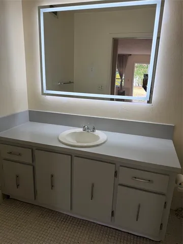 a view of a swimming pool with a table and chairs