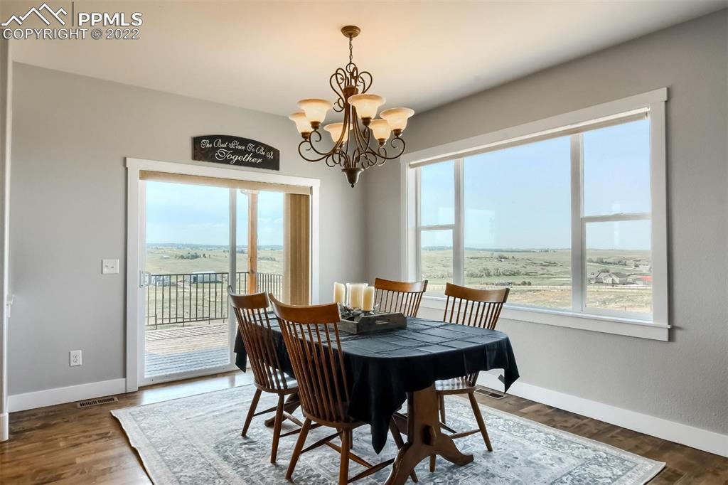 34698 Southern Cross Loop Kiowa, CO 80117 - Photo 15 of 50 a view of a dining room with furniture window and outside view