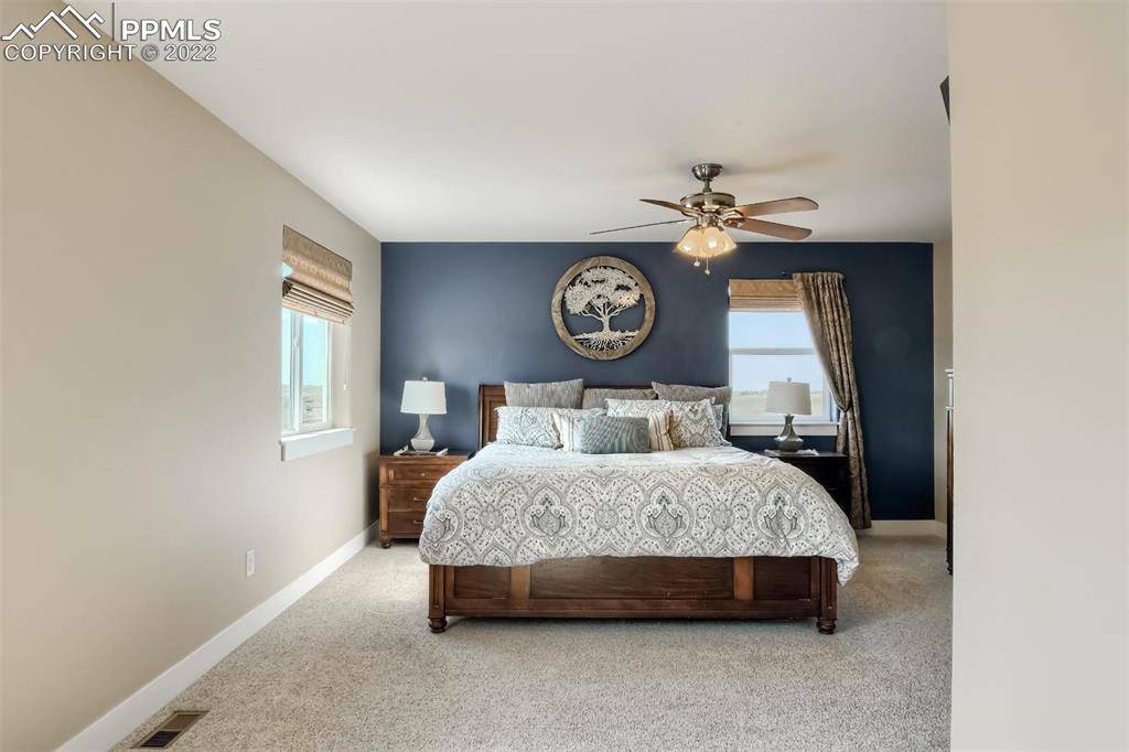 34698 Southern Cross Loop Kiowa, CO 80117 - Photo 16 of 50 a bedroom with a bed and a table in it