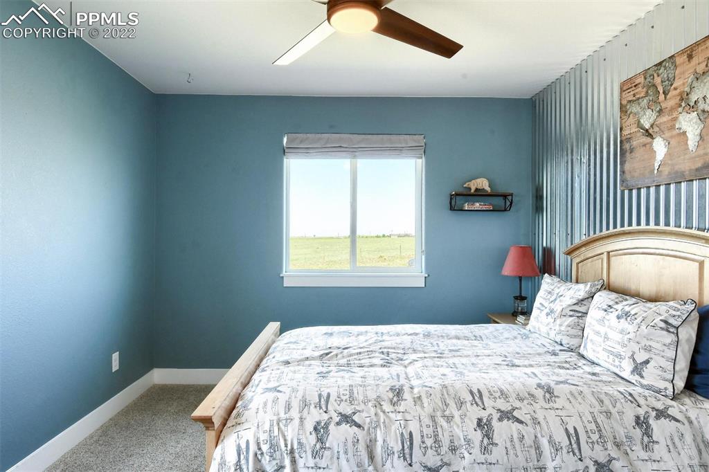 34698 Southern Cross Loop Kiowa, CO 80117 - Photo 23 of 50 a bedroom with a bed and a window