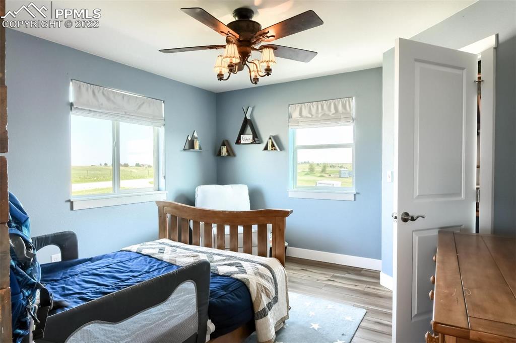 34698 Southern Cross Loop Kiowa, CO 80117 - Photo 26 of 50 a bedroom with a bed and a window