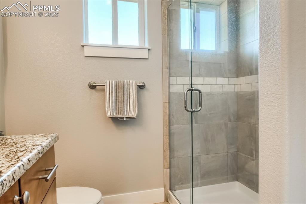 34698 Southern Cross Loop Kiowa, CO 80117 - Photo 29 of 50 a bathroom with a shower and toilet