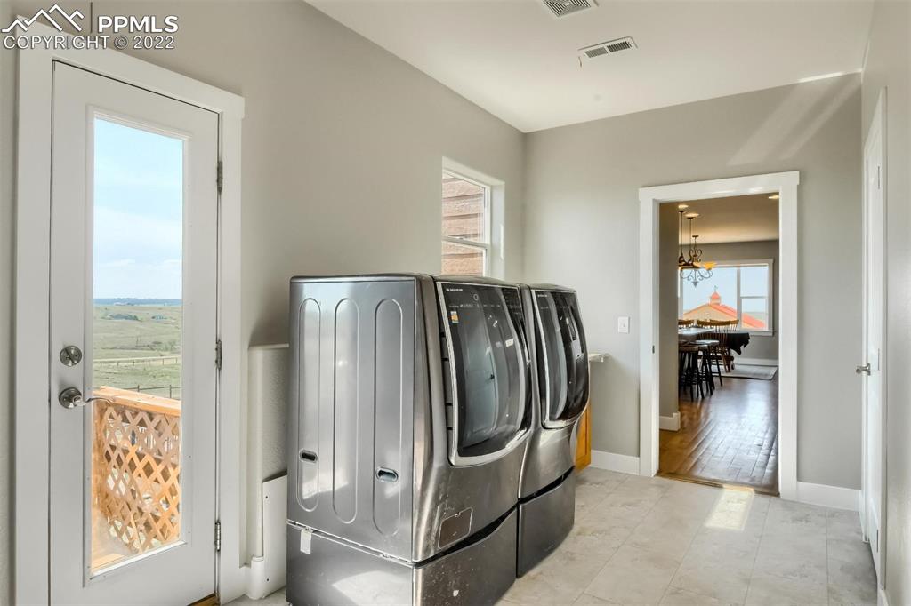 34698 Southern Cross Loop Kiowa, CO 80117 - Photo 33 of 50 a view of a hallway with windows and stairs