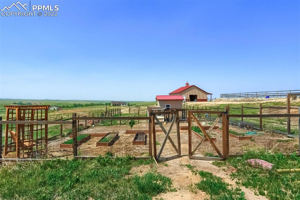 34698 Southern Cross Loop Kiowa, CO 80117 - Photo 42 of 50 a view of a swimming pool with a garden and deck