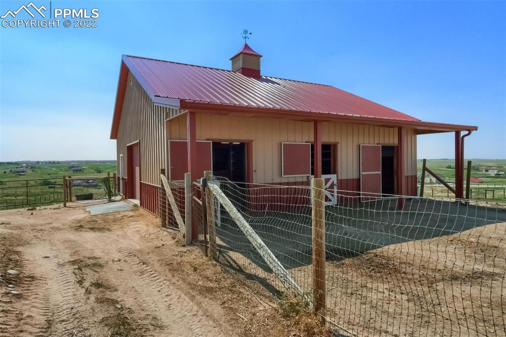 34698 Southern Cross Loop Kiowa, CO 80117 - Photo 50 of 50 a view of a house with wooden fence