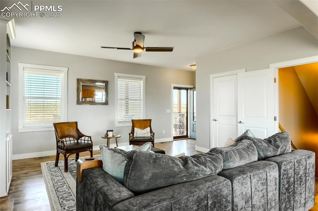 34698 Southern Cross Loop Kiowa, CO 80117 - Photo 8 of 50 a living room with furniture and a flat screen tv