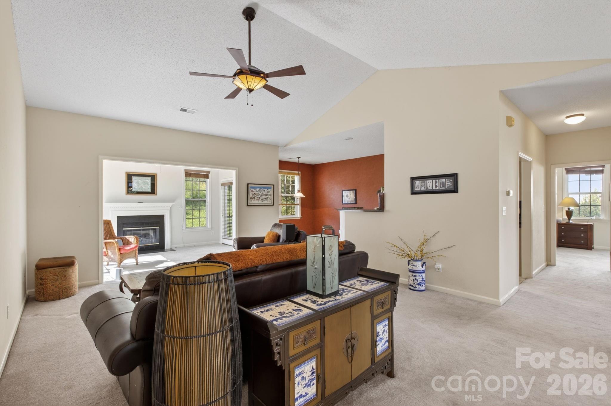 268 Farm Valley Road Fletcher, NC 28732 - Photo 7 of 30 a view of a livingroom with furniture and a ceiling fan