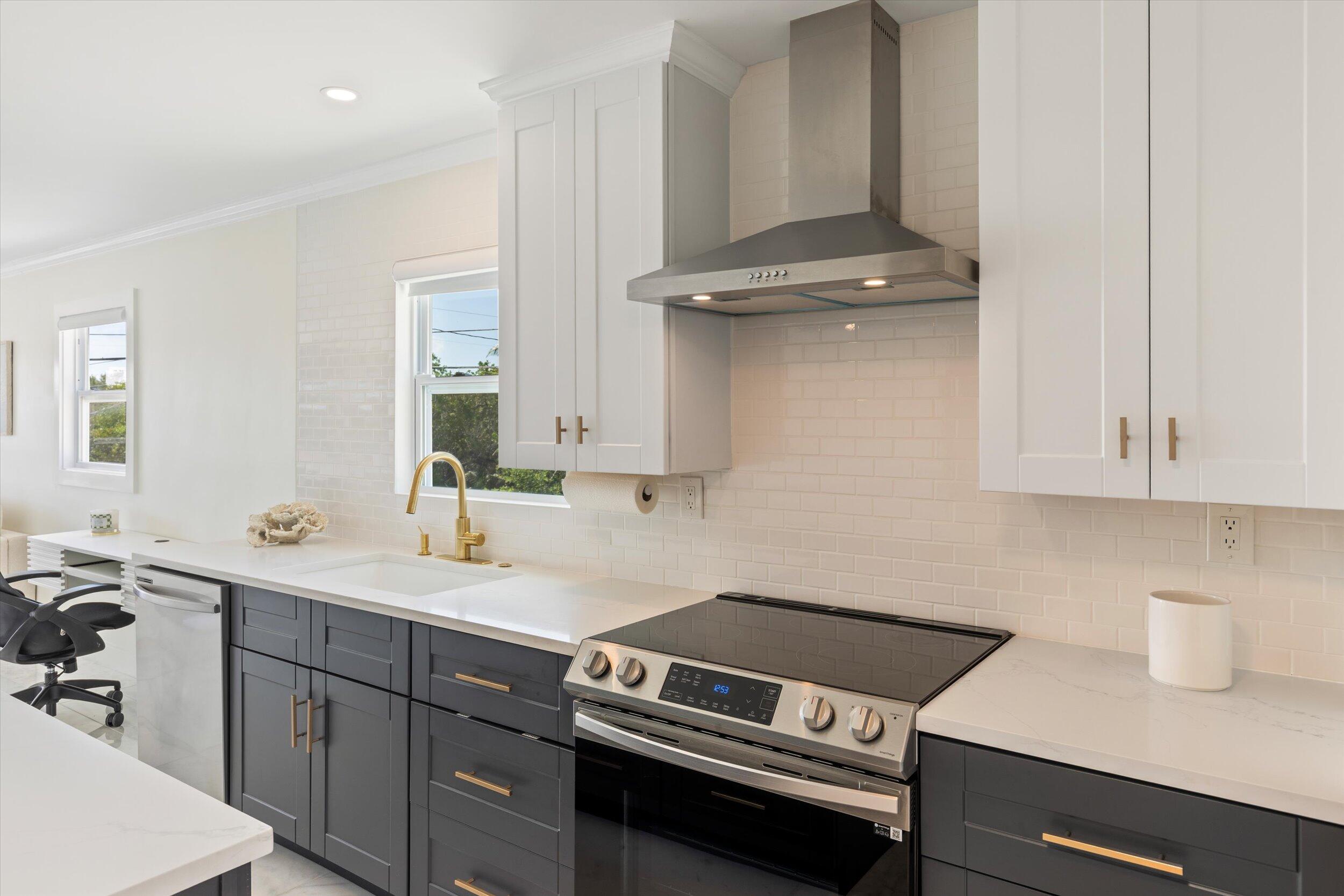 28009 Gulf Boulevard Big Pine Key, FL 33043 - Photo 11 of 42 a kitchen with a sink and cabinets