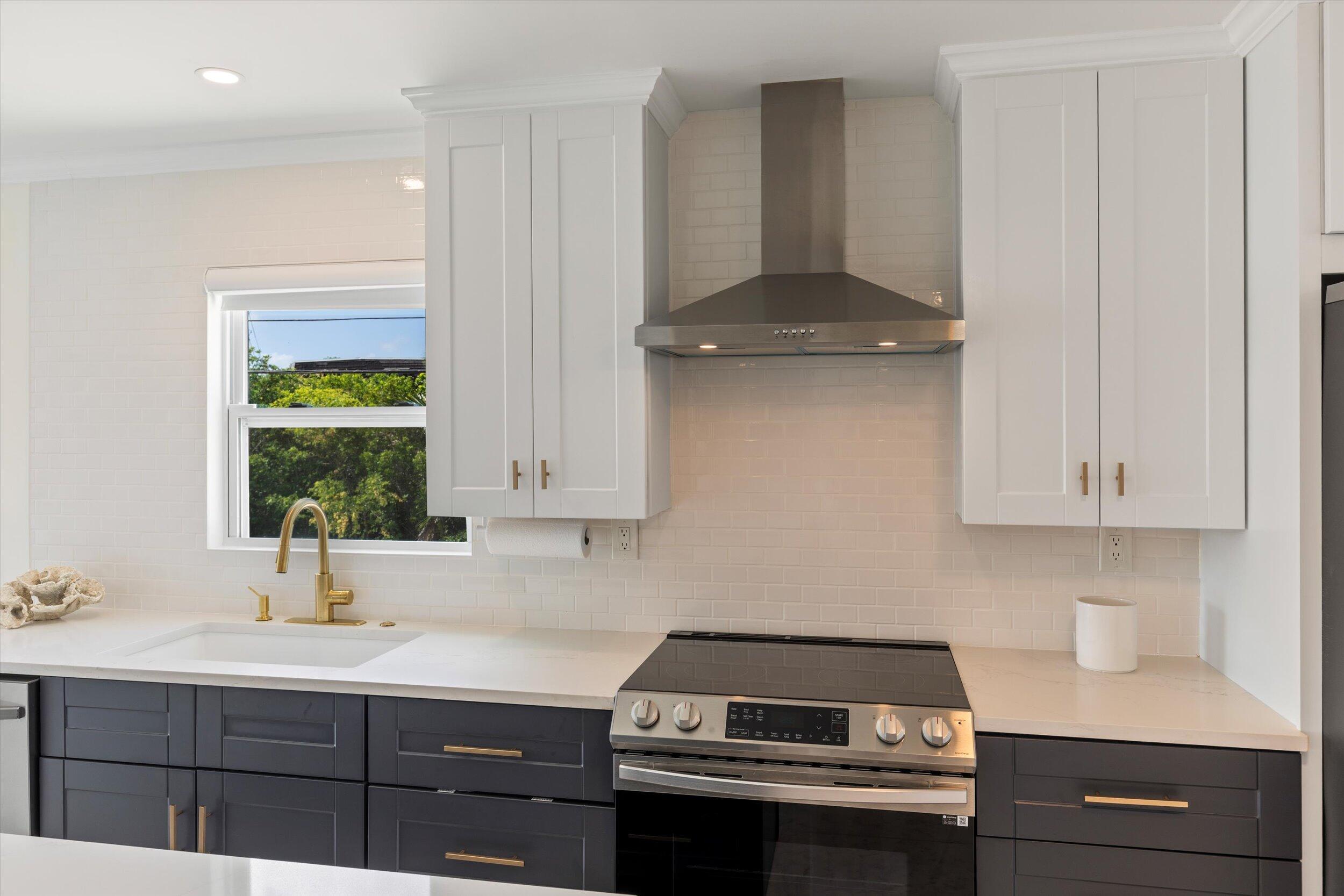 28009 Gulf Boulevard Big Pine Key, FL 33043 - Photo 12 of 42 a kitchen with a sink cabinets and window