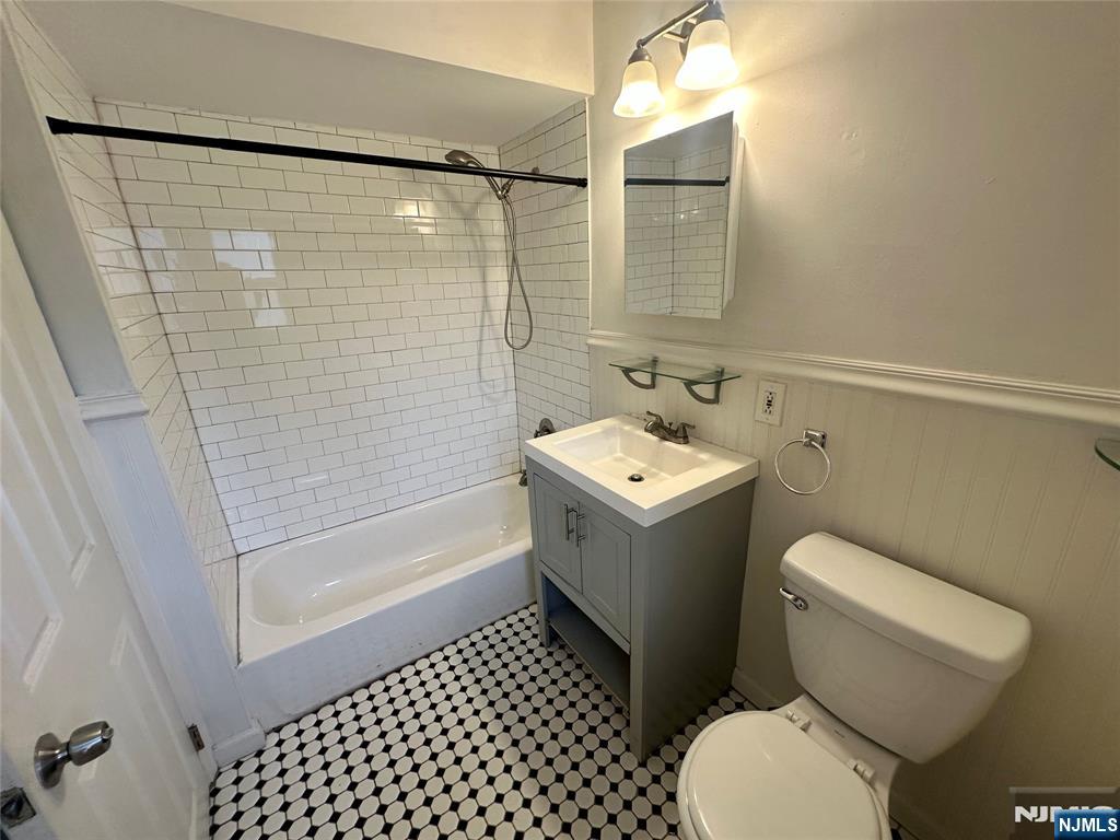 390 Orange Road Montclair, NJ 07042 - Photo 13 of 16 a bathroom with a toilet sink and shower