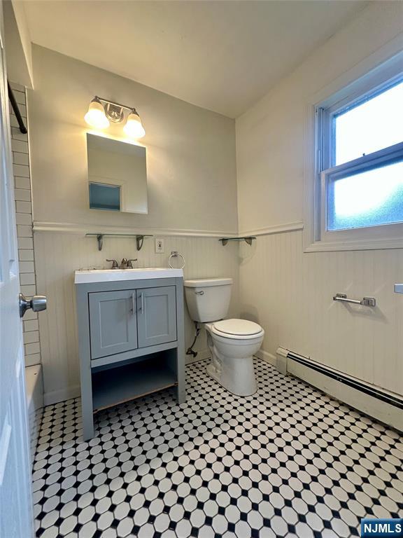 390 Orange Road Montclair, NJ 07042 - Photo 14 of 16 a bathroom with a toilet a sink and a mirror