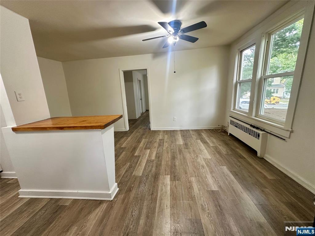 390 Orange Road Montclair, NJ 07042 - Photo 2 of 16 wooden floor in an empty room with a window