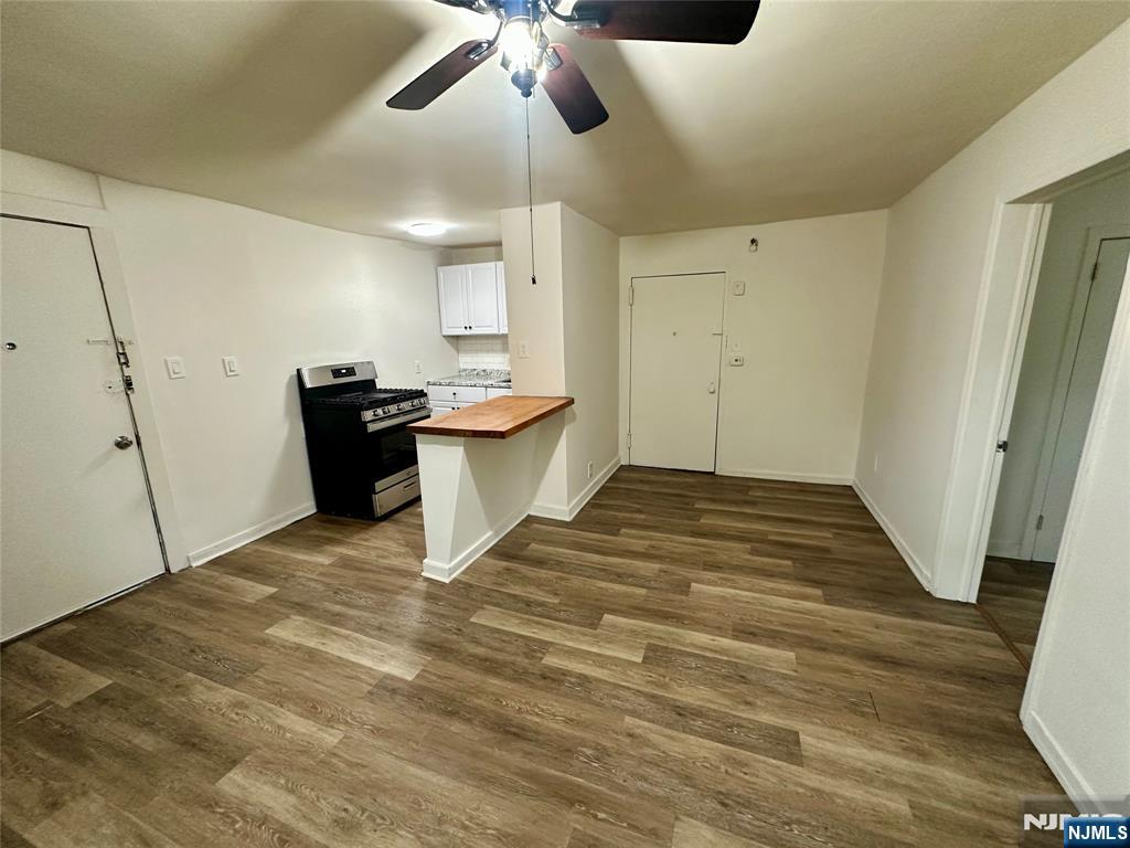 390 Orange Road Montclair, NJ 07042 - Photo 4 of 16 a view of a kitchen with wooden floor