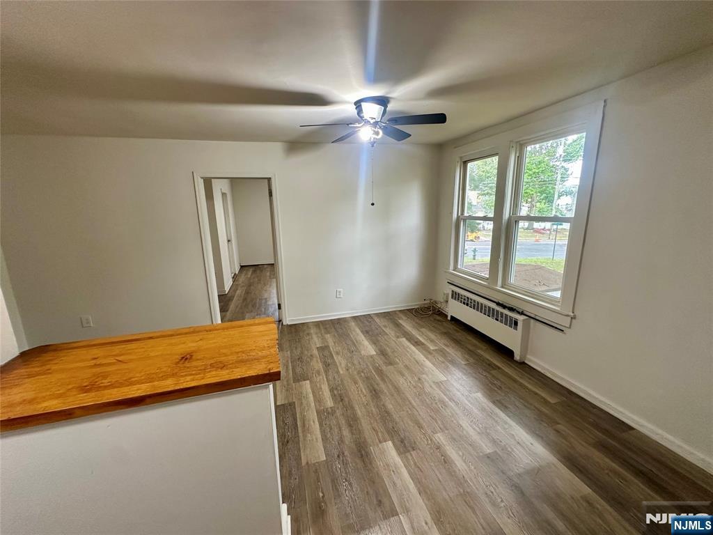 390 Orange Road Montclair, NJ 07042 - Photo 6 of 16 a view of a room with wooden floor and fan