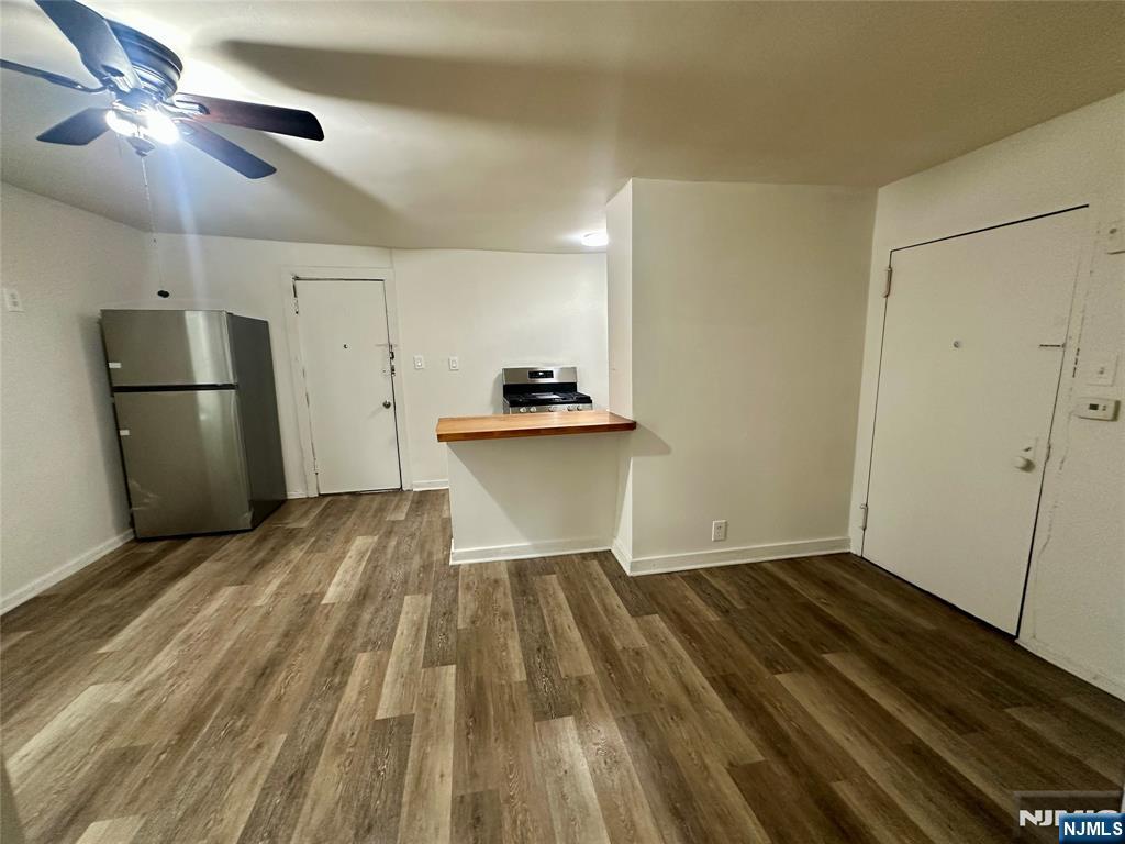 390 Orange Road Montclair, NJ 07042 - Photo 7 of 16 a view of a kitchen with a sink and refrigerator