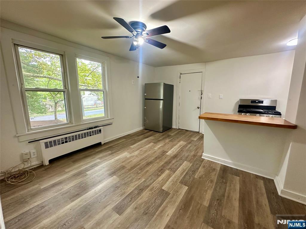 390 Orange Road Montclair, NJ 07042 - Photo 8 of 16 a view of a kitchen with a sink dishwasher and a window