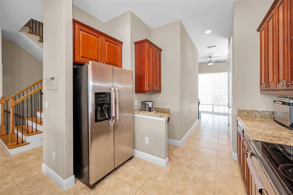 47 West Morgan Street Tarpon Springs, FL 34689 - Photo 13 of 64 a kitchen with a refrigerator and a sink