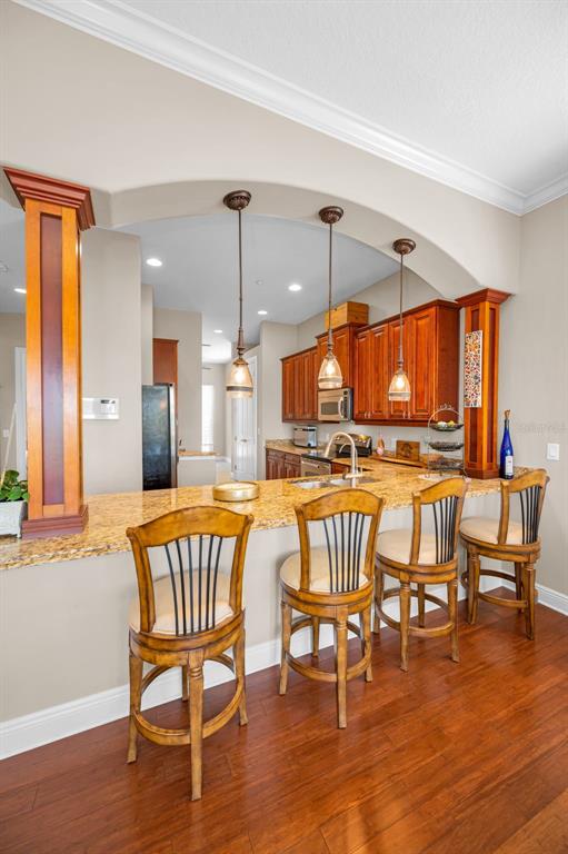 47 West Morgan Street Tarpon Springs, FL 34689 - Photo 14 of 64 a dining area with furniture and wooden floor