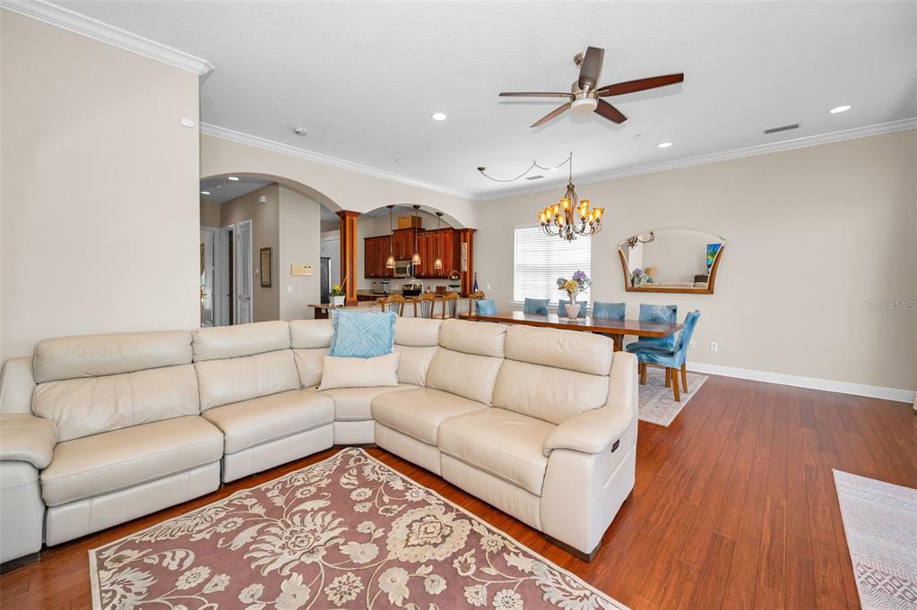 47 West Morgan Street Tarpon Springs, FL 34689 - Photo 20 of 64 a living room with furniture and a chandelier