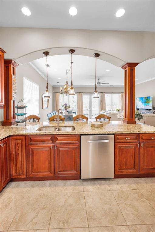 47 West Morgan Street Tarpon Springs, FL 34689 - Photo 29 of 64 a kitchen with stainless steel appliances granite countertop a sink and white cabinets
