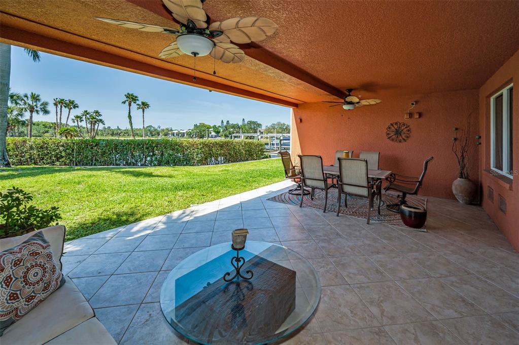 47 West Morgan Street Tarpon Springs, FL 34689 - Photo 3 of 64 a view of a patio with a table and chairs