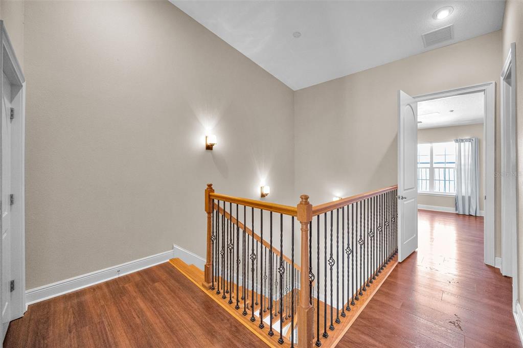 47 West Morgan Street Tarpon Springs, FL 34689 - Photo 35 of 64 a view of a hallway with wooden floor