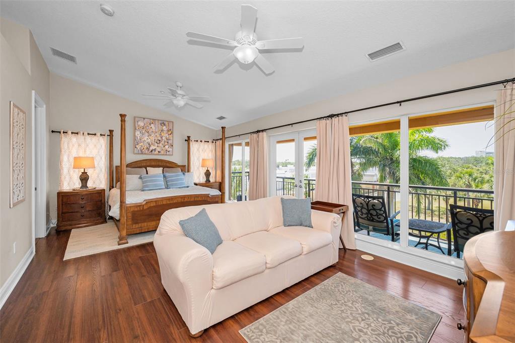 47 West Morgan Street Tarpon Springs, FL 34689 - Photo 38 of 64 a living room with furniture and a large window with wooden floor