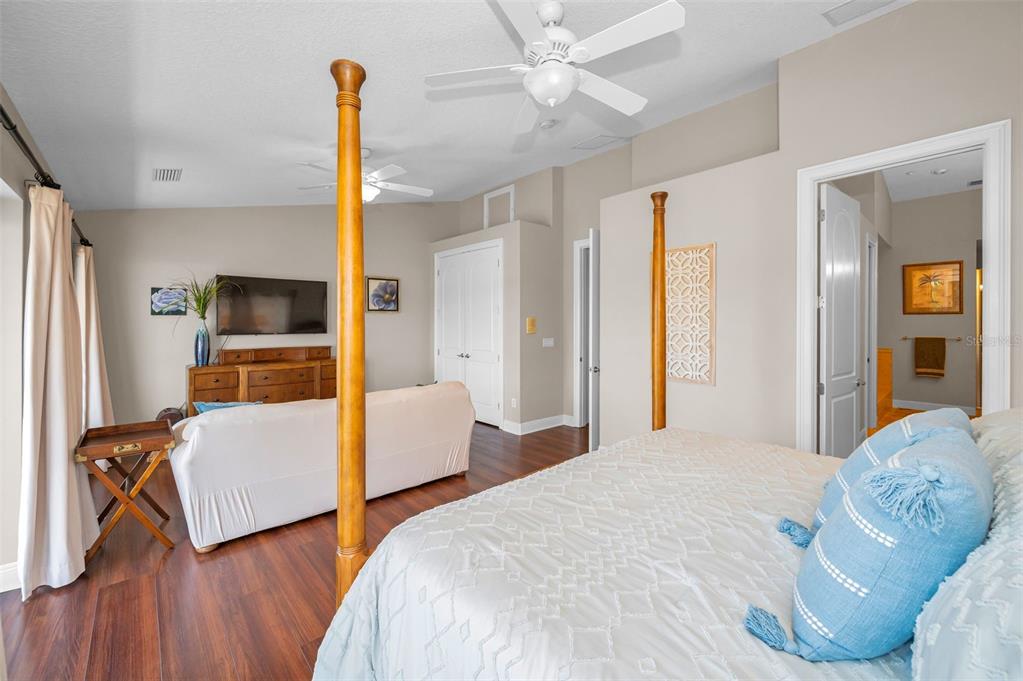 47 West Morgan Street Tarpon Springs, FL 34689 - Photo 40 of 64 a bedroom with a bed and wooden floor