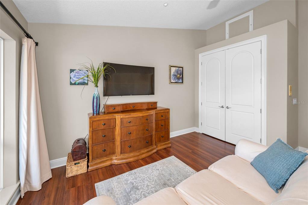 47 West Morgan Street Tarpon Springs, FL 34689 - Photo 41 of 64 a living room with furniture and a flat screen tv