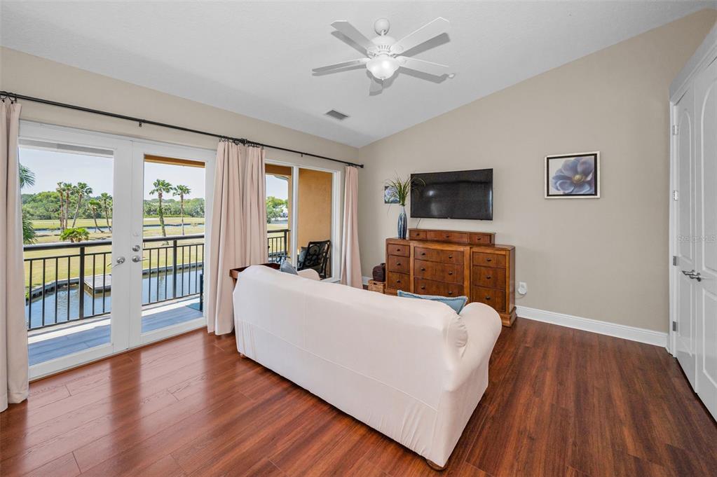 47 West Morgan Street Tarpon Springs, FL 34689 - Photo 42 of 64 a living room with furniture and a flat screen tv